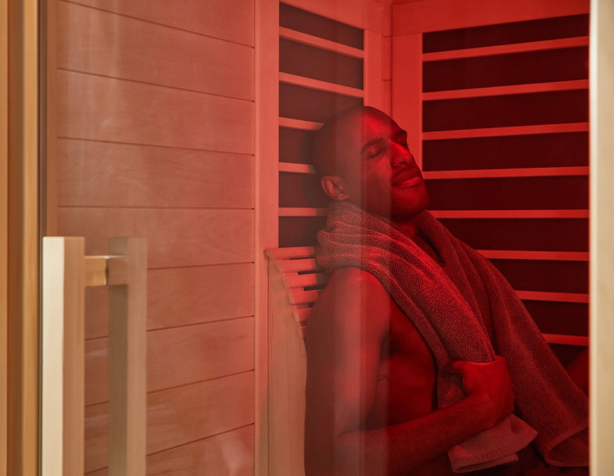 Man relaxing in Sunlighten infrared sauna at Body Reset Recovery in Clinton MD
