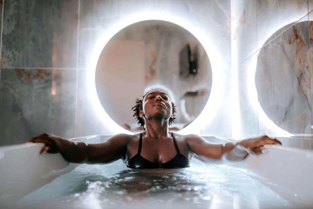 Black woman in cold plunge tub